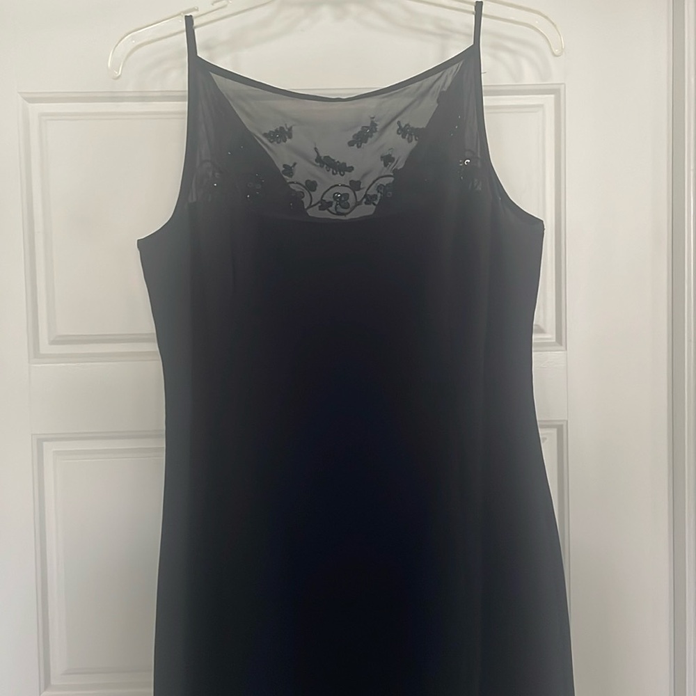 Evening dress with mesh at top portion with beading design. Zip dress